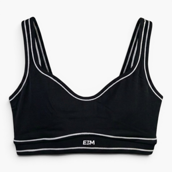 E3M Performance Sports Bra in black with white piping, front view